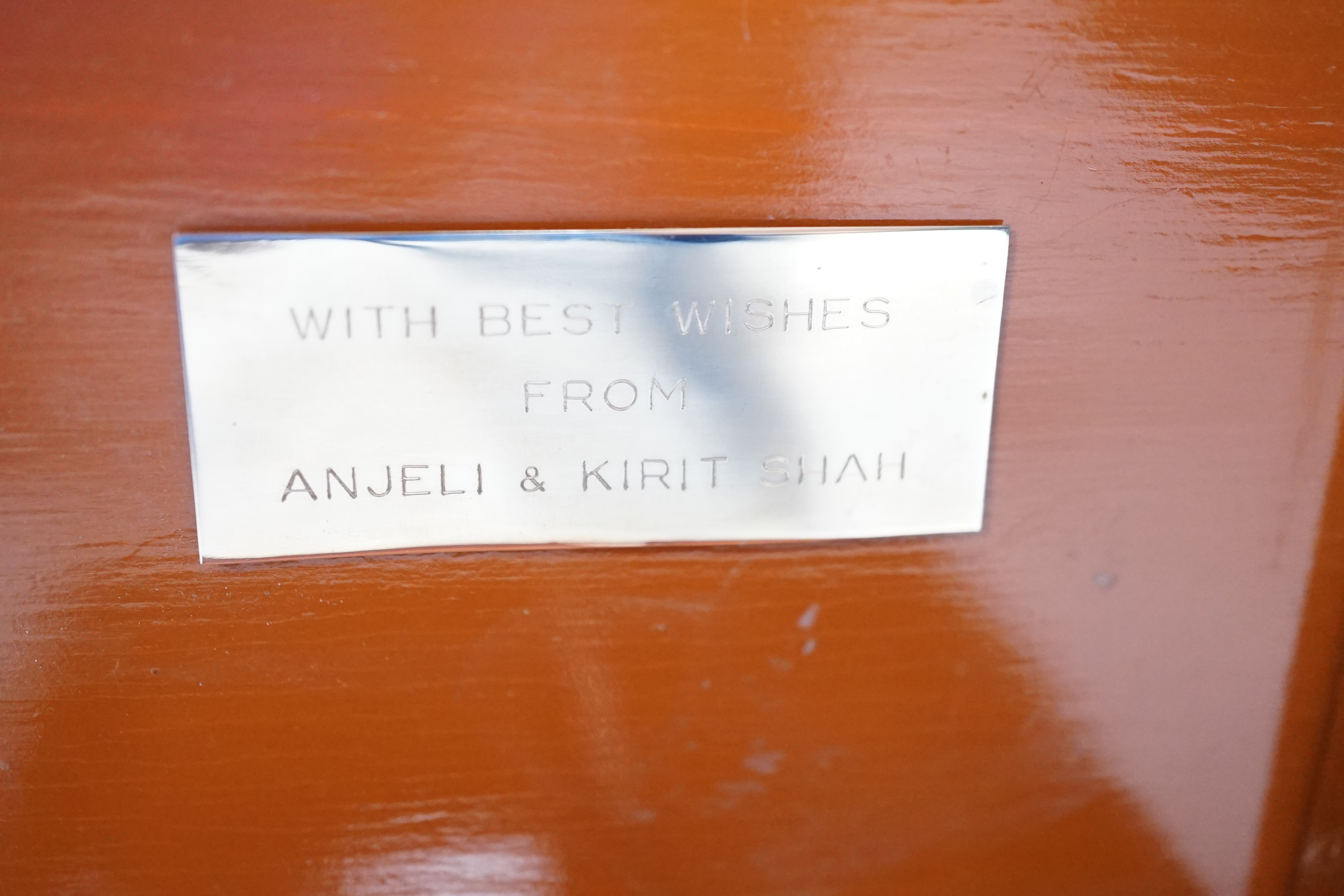 A Thai white metal cigarette box, stamped sterling, 14cm, and a similar sterling overlaid photograph frame, width 16cm